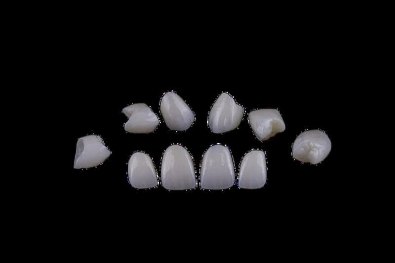 Full-contour zirconia unit — individual crowns on a black background